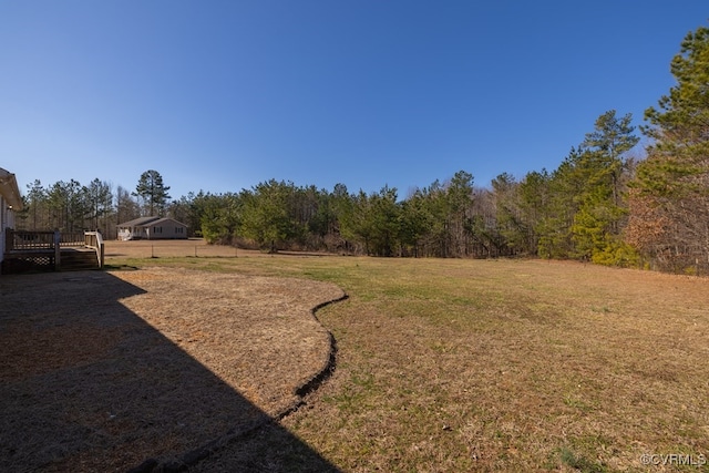 view of yard featuring a wooden deck