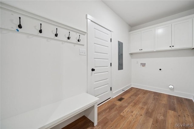 mudroom featuring hardwood / wood-style flooring, electric panel, and baseboards