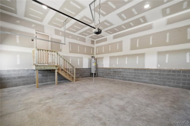 garage featuring a garage door opener and electric water heater