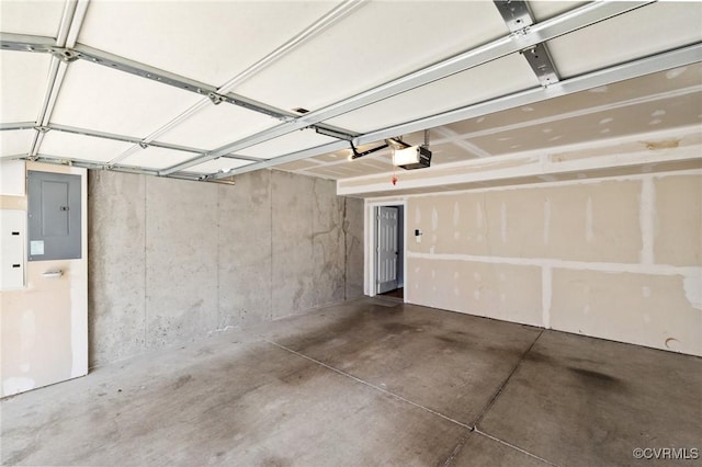 garage with electric panel and a garage door opener