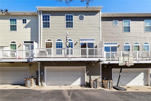 back of house featuring a garage