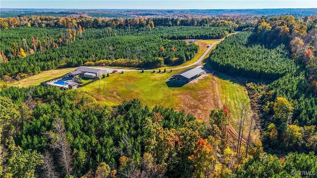 aerial view featuring a wooded view