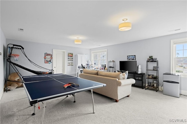 recreation room featuring visible vents and light colored carpet