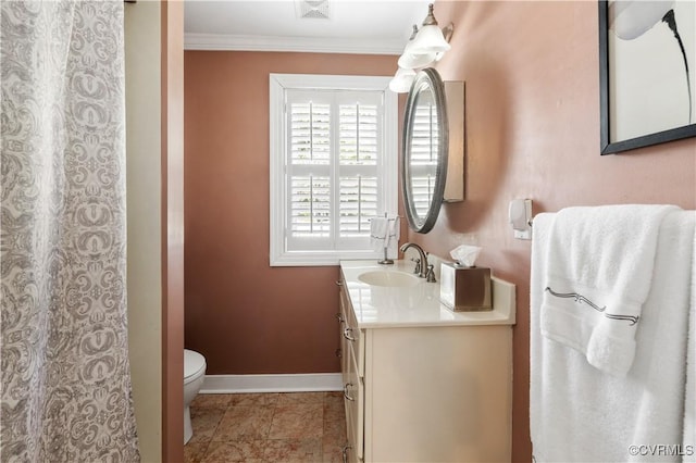 bathroom with visible vents, toilet, crown molding, baseboards, and vanity