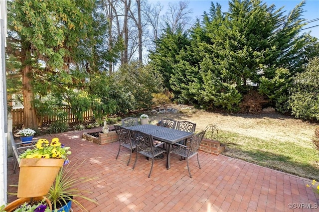 view of patio / terrace with outdoor dining area and fence