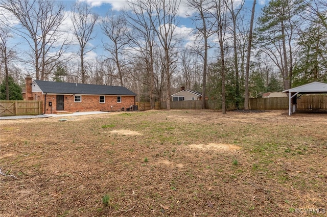 view of yard featuring a fenced backyard