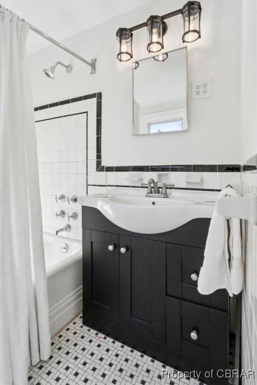 full bath featuring shower / tub combo with curtain and vanity