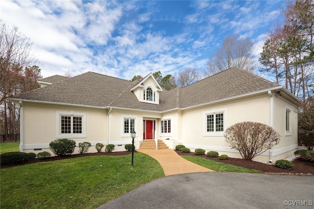 view of front facade featuring a front yard, crawl space, and roof with shingles