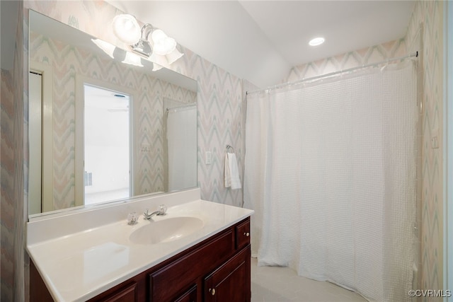 bathroom with recessed lighting, vanity, and a shower with curtain