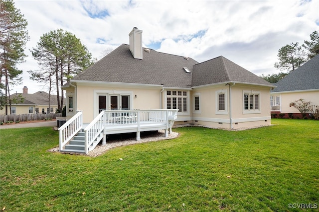 back of property with roof with shingles, a yard, crawl space, and a wooden deck