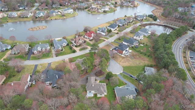 birds eye view of property with a residential view and a water view