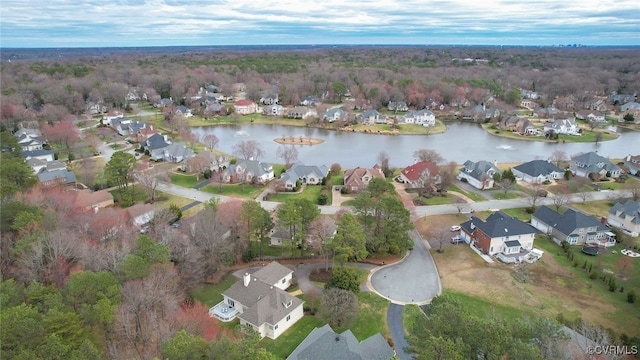 birds eye view of property with a water view and a residential view