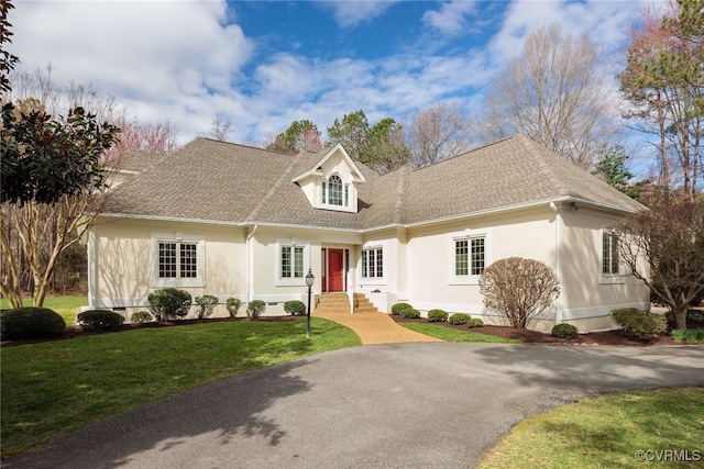 cape cod home featuring crawl space, stucco siding, a front lawn, and roof with shingles