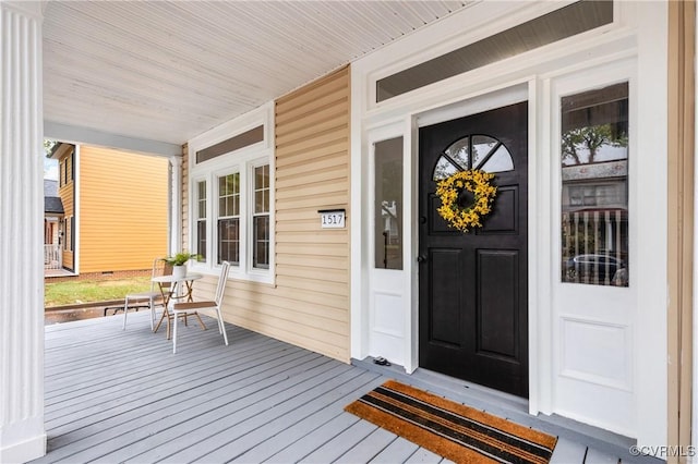 doorway to property with a porch