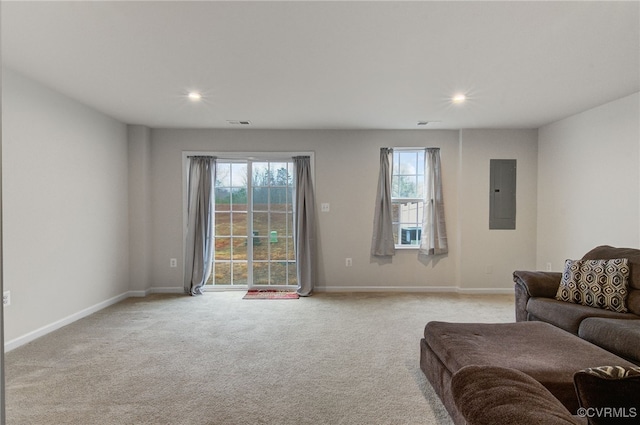 living room featuring recessed lighting, visible vents, light carpet, electric panel, and baseboards