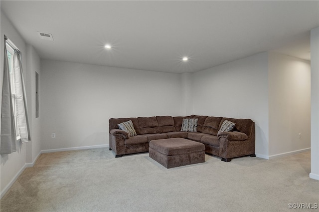 living room featuring baseboards, recessed lighting, visible vents, and light colored carpet