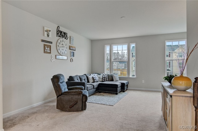 living room featuring carpet floors and baseboards