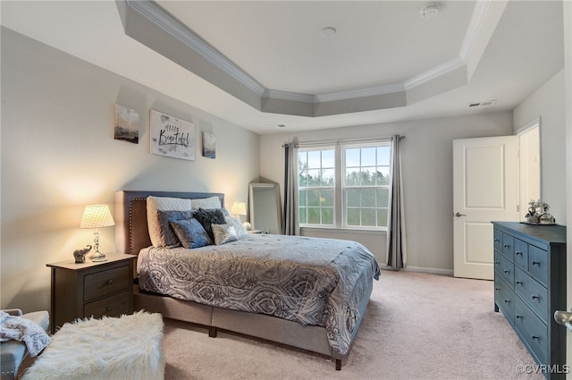 bedroom with light colored carpet, visible vents, baseboards, a raised ceiling, and crown molding