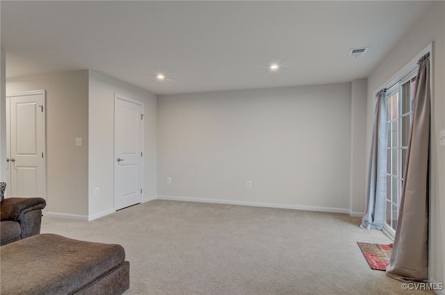 sitting room featuring light carpet, baseboards, visible vents, and recessed lighting