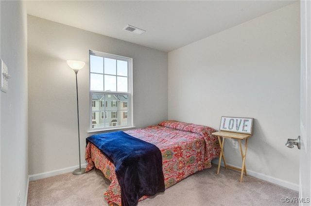 bedroom with baseboards, visible vents, and carpet flooring