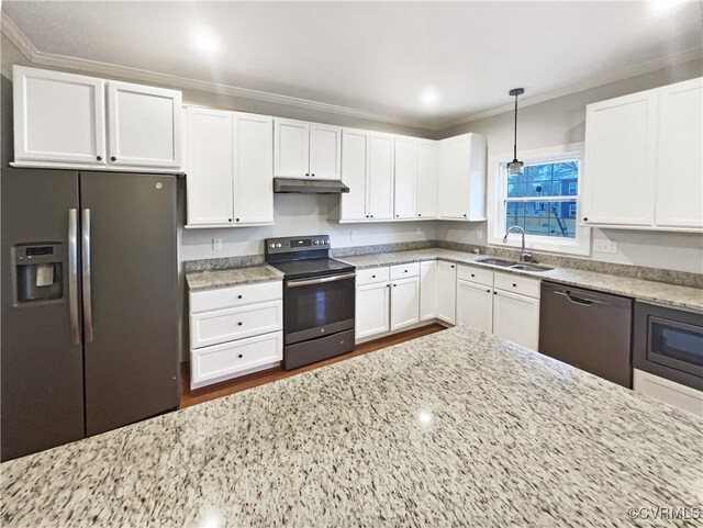 kitchen with appliances with stainless steel finishes, white cabinets, a sink, light stone countertops, and under cabinet range hood