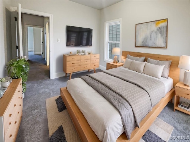 bedroom with baseboards and carpet flooring