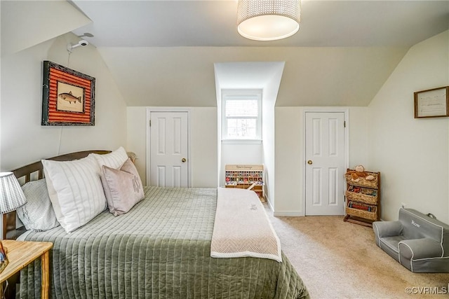 bedroom featuring carpet floors and vaulted ceiling