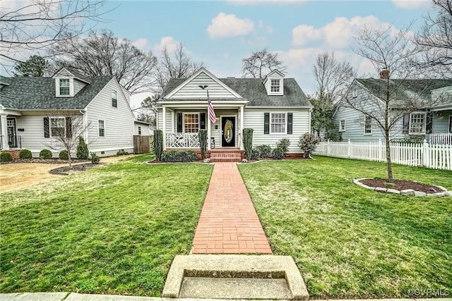 view of front of house featuring a porch, fence, and a front lawn