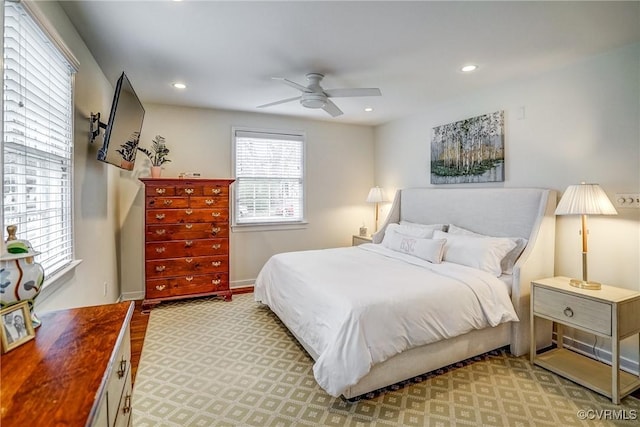 bedroom featuring light colored carpet, recessed lighting, baseboards, and ceiling fan