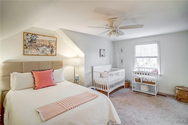 bedroom with lofted ceiling, carpet, and ceiling fan