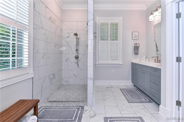 bathroom featuring ornamental molding, marble finish floor, baseboards, and walk in shower