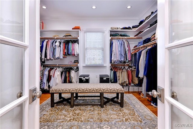 spacious closet featuring wood finished floors