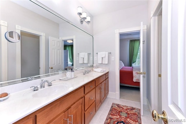 bathroom featuring a sink, double vanity, connected bathroom, and tile patterned floors