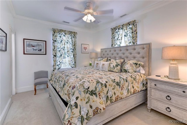 bedroom featuring baseboards, ornamental molding, visible vents, and light colored carpet