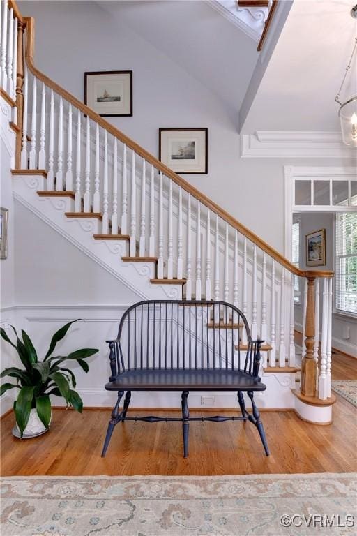 stairway featuring wood finished floors