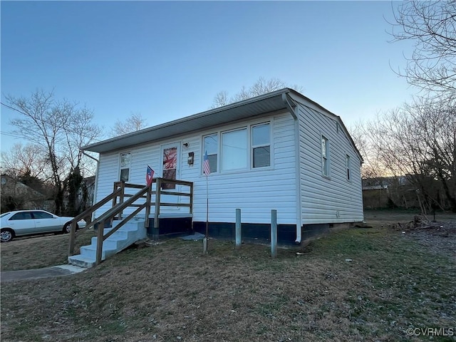 bungalow-style house featuring a front yard