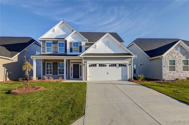 view of front of home featuring an attached garage, concrete driveway, board and batten siding, and a front yard