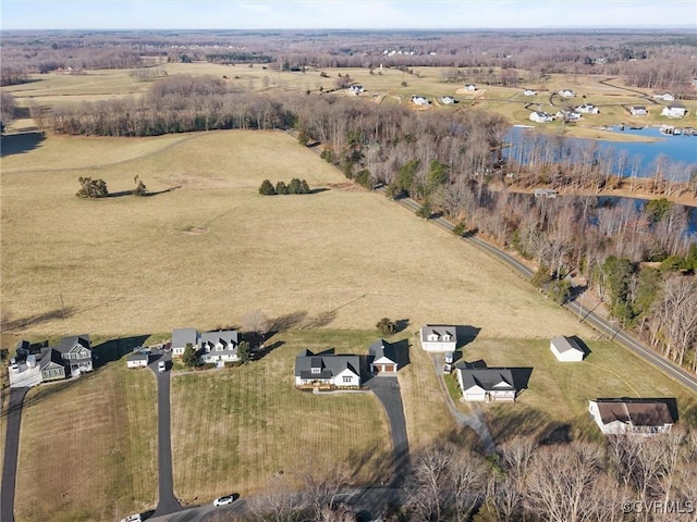 birds eye view of property with a rural view and a water view