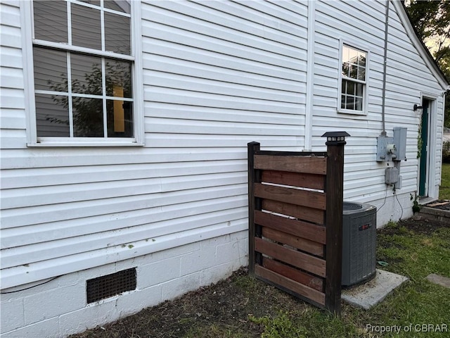 1029 7th St, Petersburg, VA 23803 - exterior view of crawl space, electric meter, and cooling unit