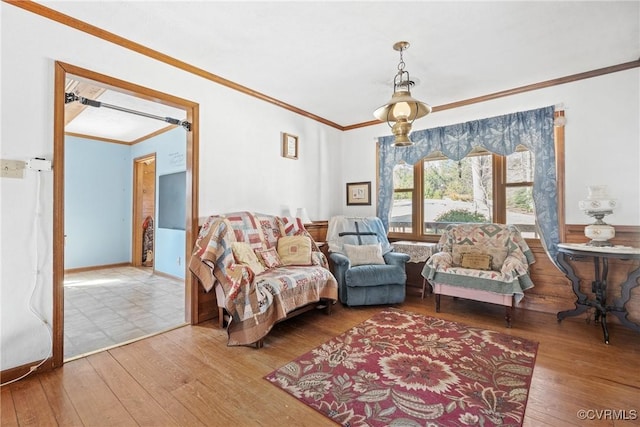 living room with ornamental molding and hardwood / wood-style floors