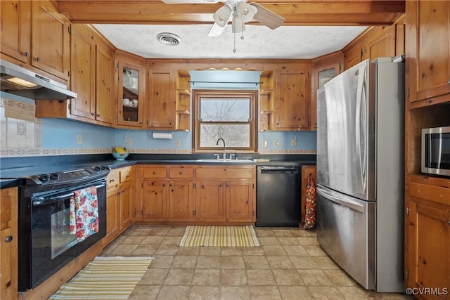 kitchen with under cabinet range hood, a textured ceiling, black appliances, open shelves, and a sink