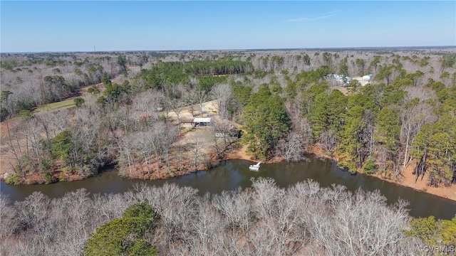 bird's eye view with a water view and a forest view