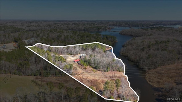 aerial view featuring a water view and a wooded view