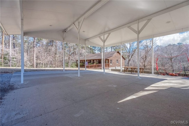 view of parking / parking lot with a carport