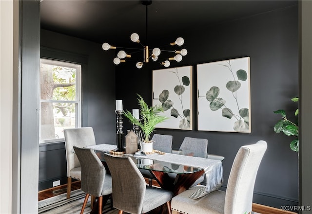 dining space with wood finished floors