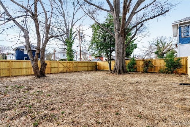 view of yard with a fenced backyard