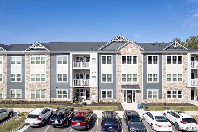 view of property featuring uncovered parking