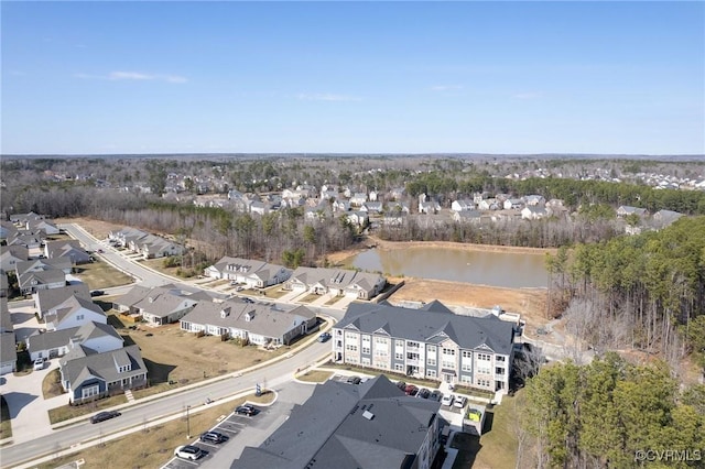 drone / aerial view featuring a residential view and a water view