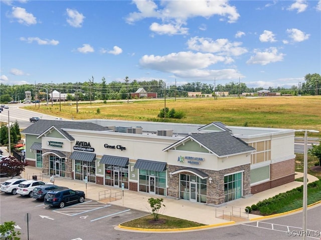 view of property with uncovered parking