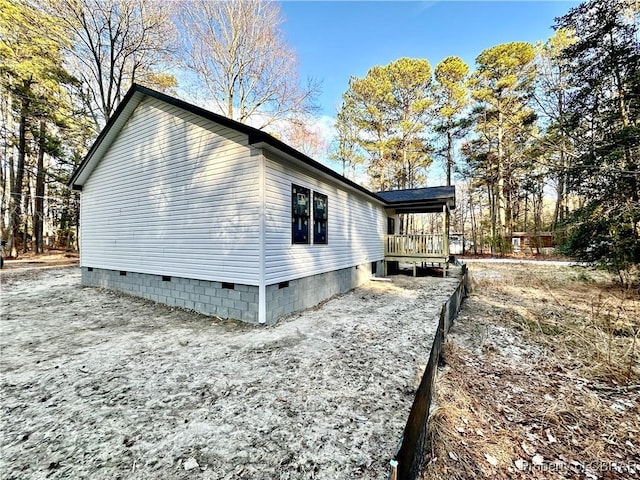 view of side of property featuring crawl space